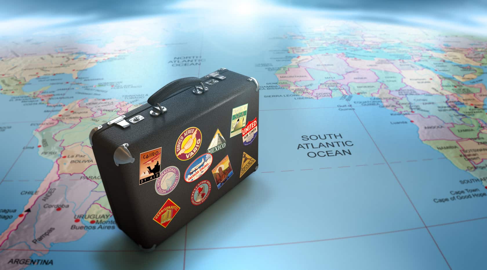 immagine cartina con valigia da viaggiatore